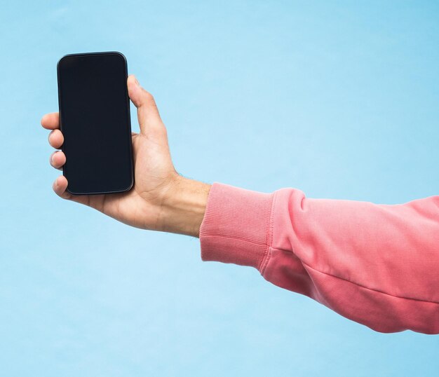 Man hand or phone screen mockup on isolated blue background in social media app or blank web design Zoom student or model person with technology mock up for city contact communication or branding