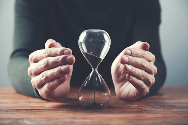 Man hand sand clock