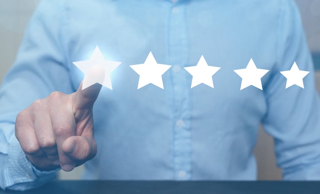 man hand showing on five star excellent rating.
