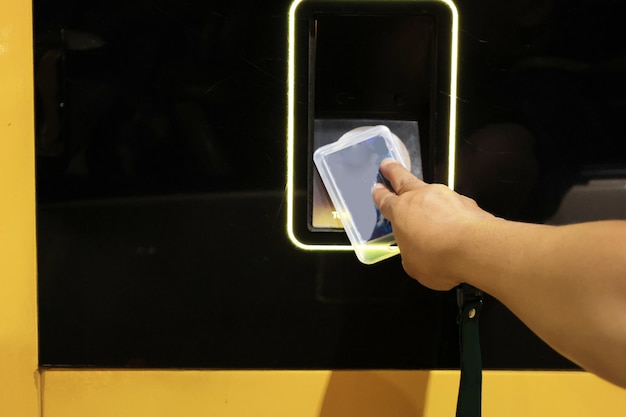 Photo man hand tapping e toll card as highway payment