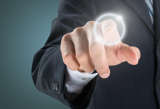 Man hand touch sign on blackboard