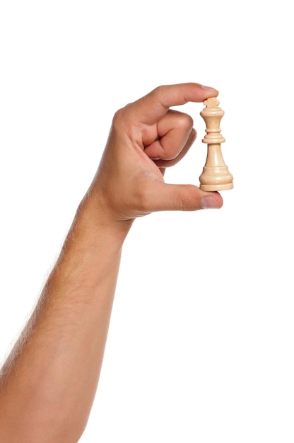 Фото Рука человека с фигурными шахматами изолирована на белом фоне