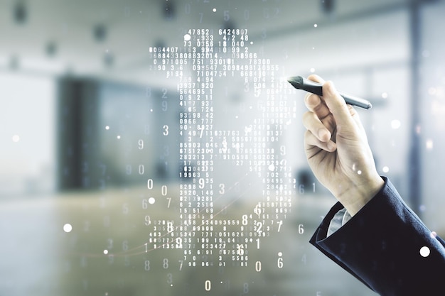 Man hand with pen working with virtual Bitcoin hologram on blurred office background Multiexposure