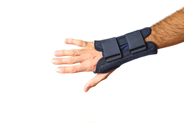Photo man hand with therapeutic wrist brace to relieve wrist sprain pain