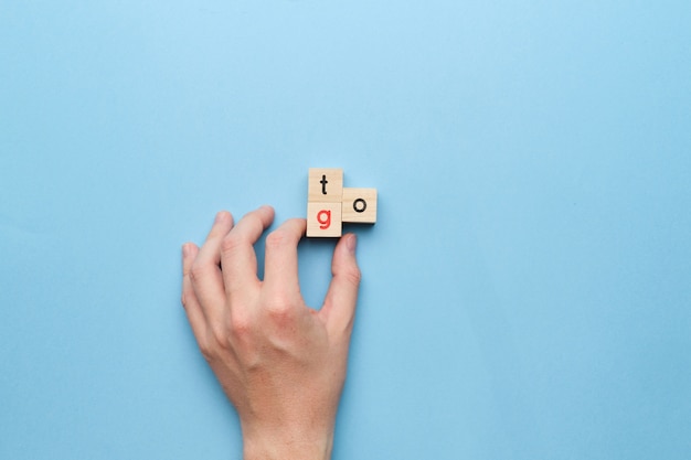 Man hand with wooden blocks