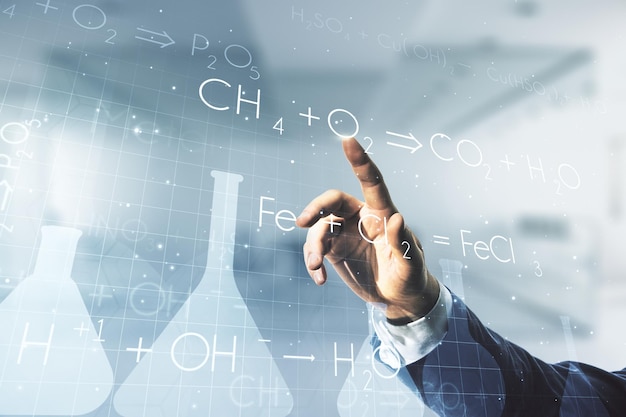 Man hand working with abstract virtual Creative chemistry hologram on blurred office background Multiexposure