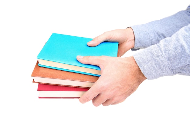 Мужские руки держат книги, изолированные на белом фоне