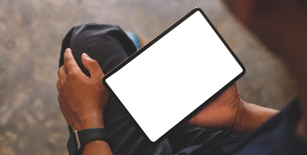 Man hands holding digital tablet with white screen