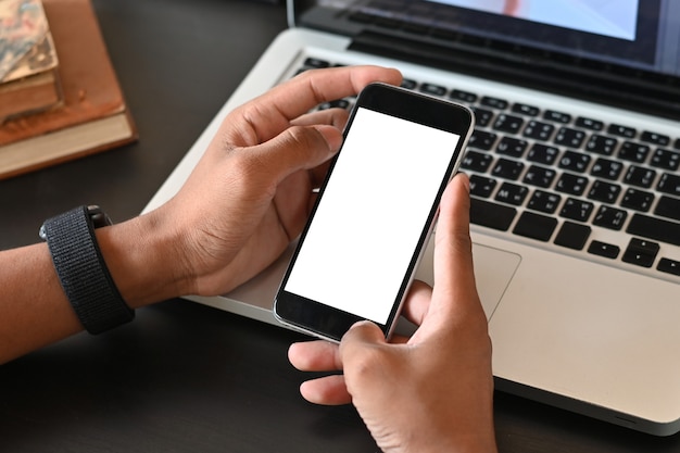 Man hands holding smart phone with blank copy space screen for your text message or information content