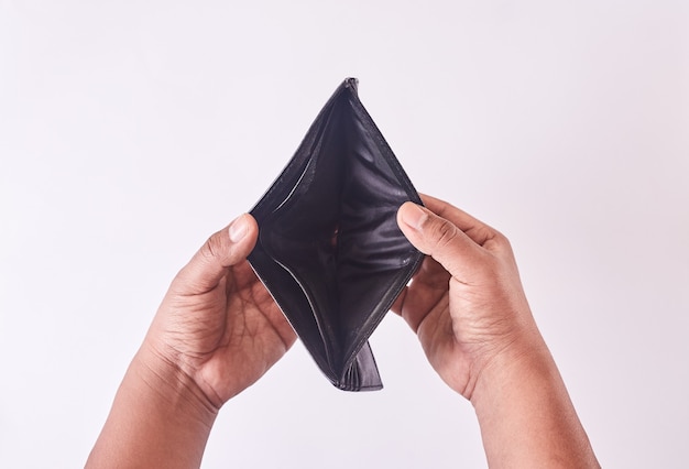 Man hands looking for money in wallet. Wallet without money