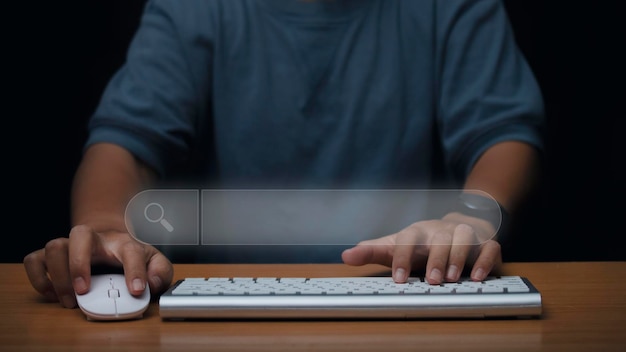 Photo man hands using a computer keyboard to searching for information data on internet networking search engine optimization seo networking concept