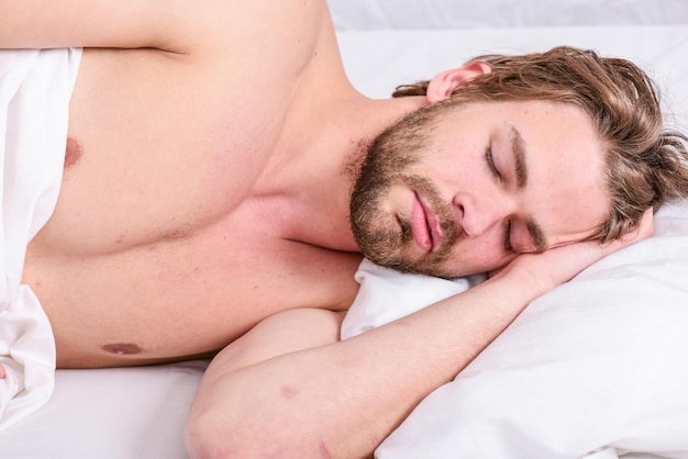Man handsome guy lay in bed in morning tips on how to wake up\
feeling fresh and energetic morning routine tips to feel good all\
day how to get up in morning feeling fresh late morning\
overslept