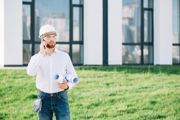 Man in hardhat talking on phone