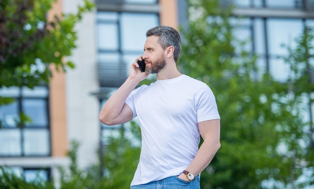 Man has phone call outdoor man having phone call in the street man call on phone outside