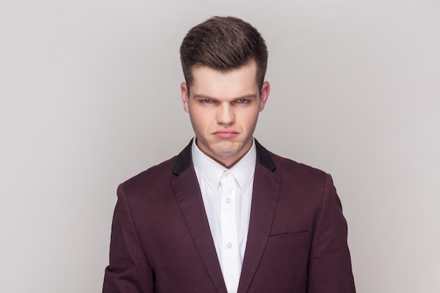 Man has unhappy look expresses regret and sadness frowns face being frustrated