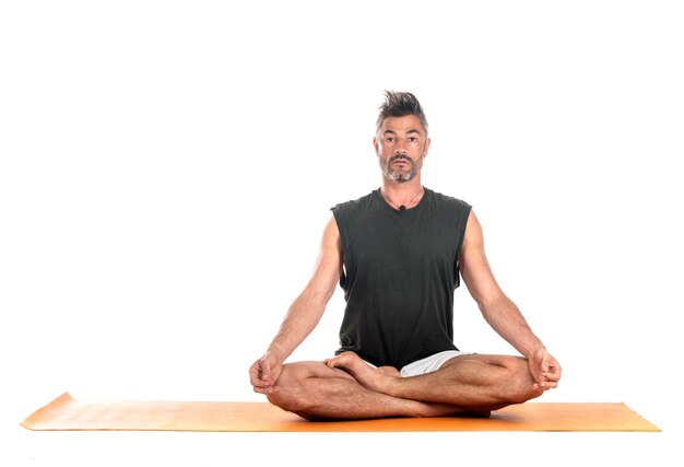 Photo man and hatha yoga asana in front of white background