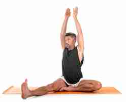 Photo man and hatha yoga asana in front of white background