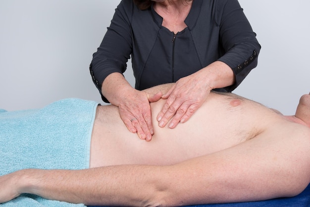 Man having an abdomen massage at spa center