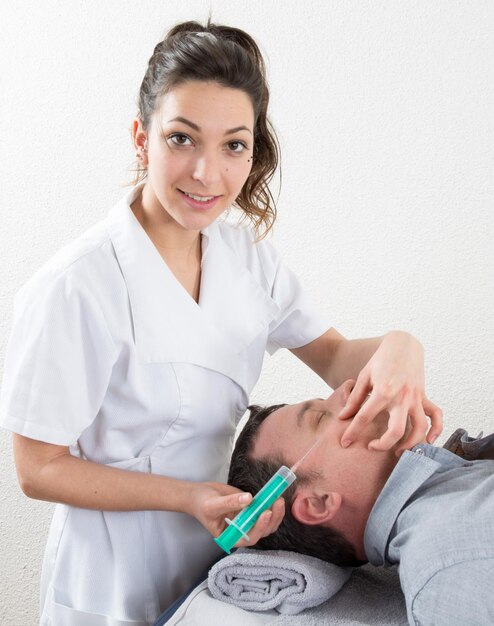 Man Having Botox Treatment At Beauty Clinic