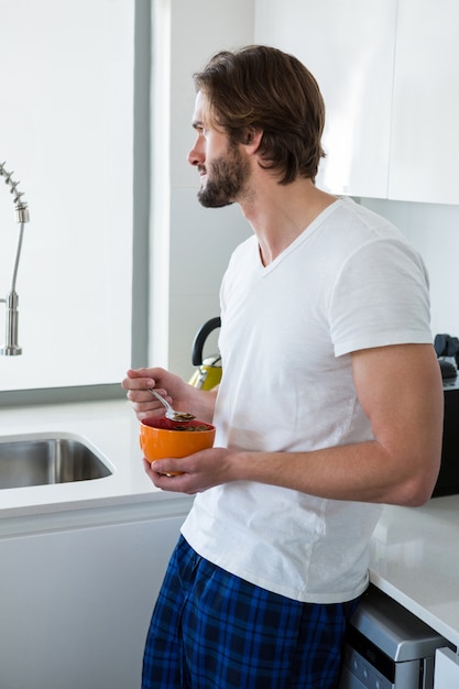 Man having breakfast in kitchen