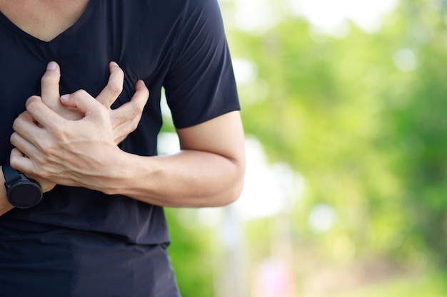 Man having chest pain heart attack outdoors or Heavy exercise causes the body to shocks heart diseasex9