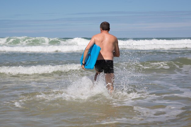 Man having fun at the beach during summertime