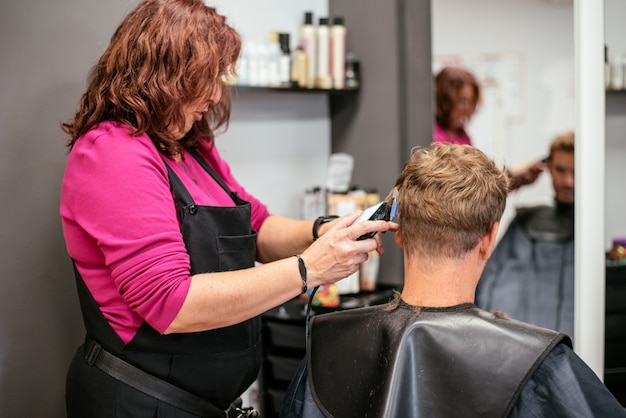 Man having his hair cut in a barbershop