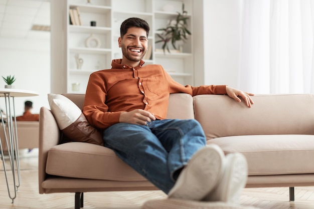 Man having rest at home on the couch