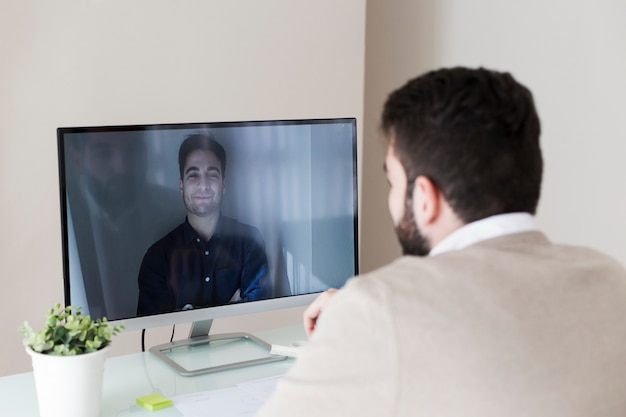 Man having video conversation