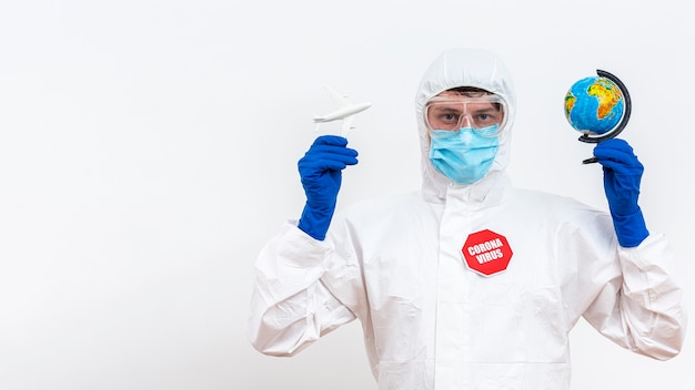 man in hazmat suit with travel interdiction