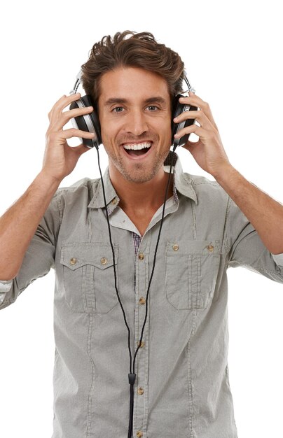 Man headphones and portrait with smile in studio for music audio subscription and multimedia sound on white background Excited model streaming radio hearing podcast and listening to digital song