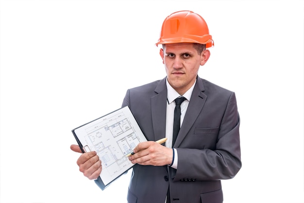 Man in helmet pointing with pen at clipboard