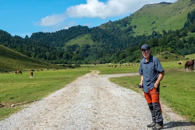 Man hiker walking in the Pyrenees mountain (plateau du benou)