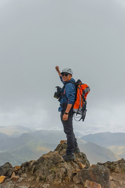 Man hiking at mountains with backpack