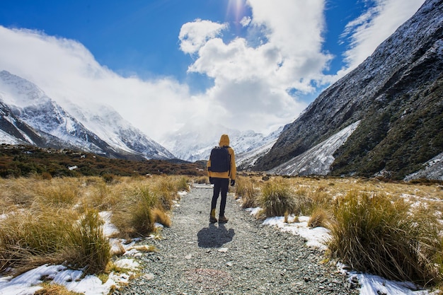 Man hiking on the snow mountainshooker valley in mount cook new zealand