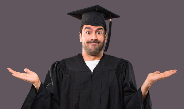 Man on his graduation day University having doubts and with confuse face expression