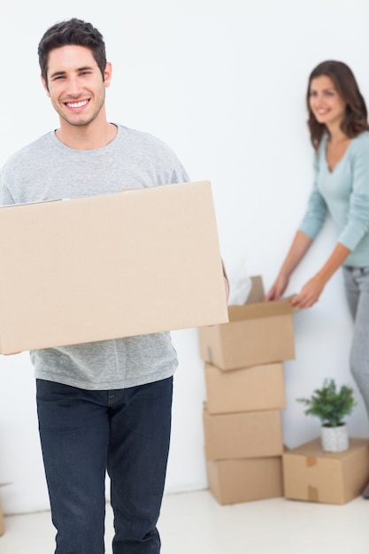 Man and his wife moving in a new house