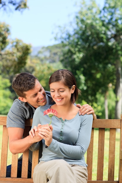 Man and his wife with a flower