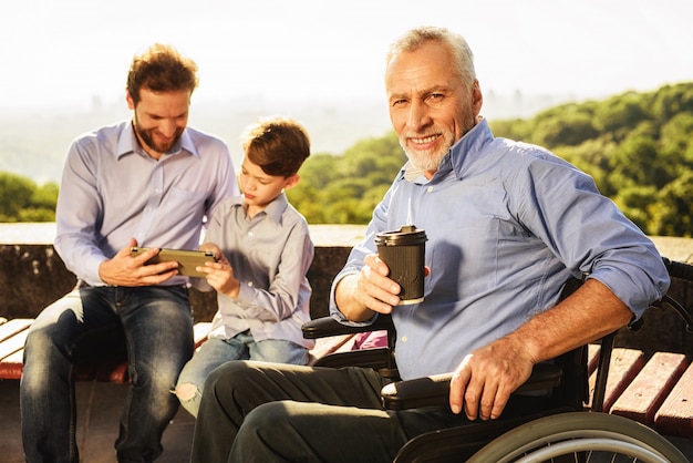 Man Hold Coffee Grandfather Son and Grandson