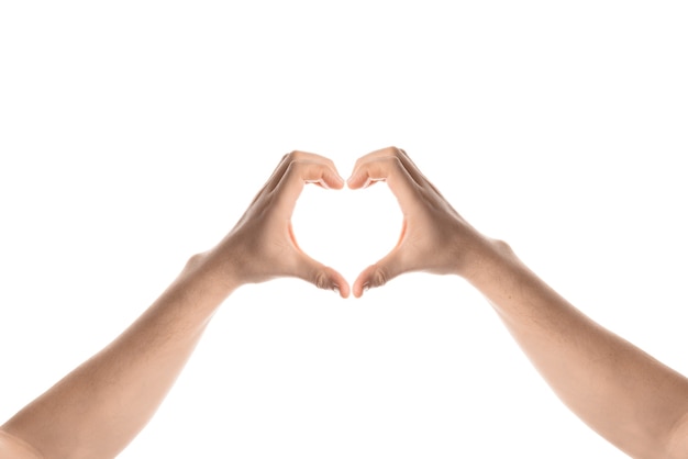 Man hold a heart-shaped hand gesture. Isolated on white background.