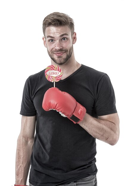 man hold lollipop in boxing glove healthy food and dieting boxer with candy with love lettering on stick calorie sweet and strong love and power valentines day vintage filter