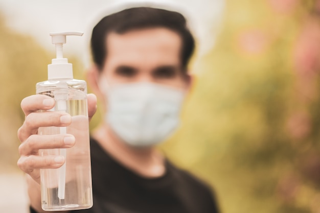 Man holding alcohol gel