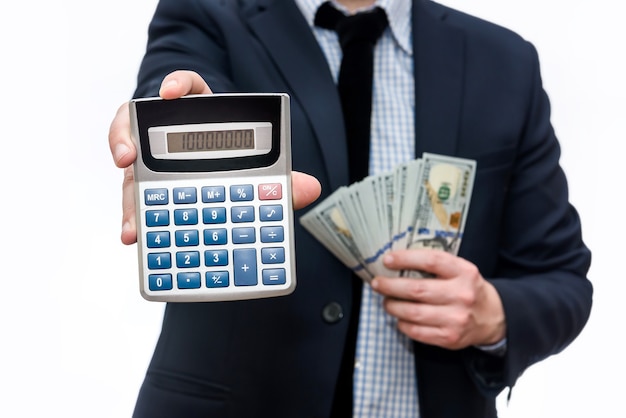 Man holding american dollar banknotes and calculator
