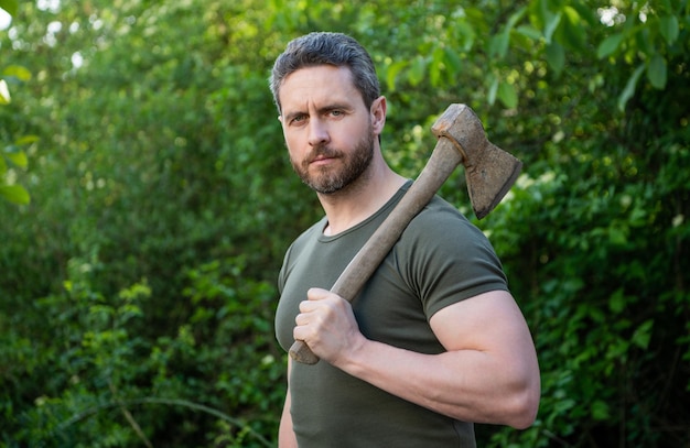 Man holding axe outdoor photo of man with axe man with axe man with axe wearing shirt