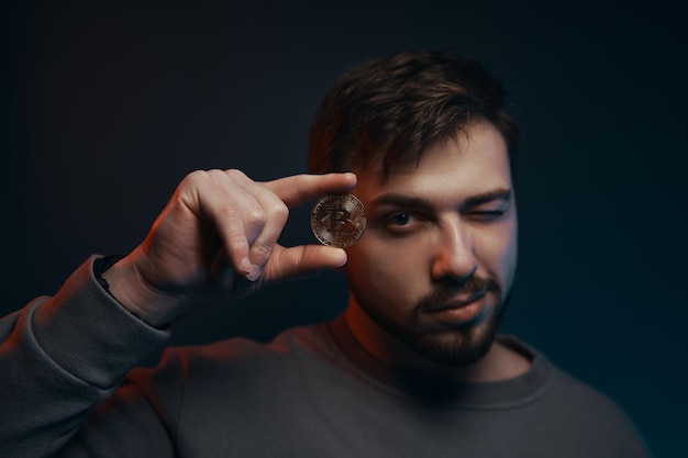 Man holding bitcoin Cryptocurrency in hand