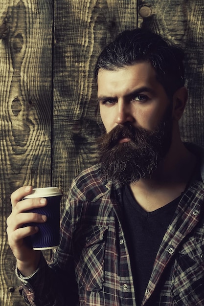 Man holding blue plastic cup