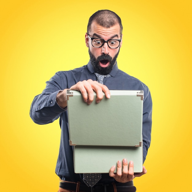 Man holding a box on colorful background