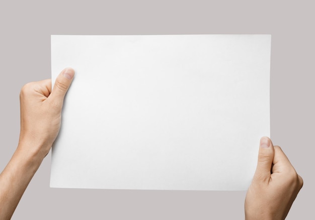 Man holding brochure with blank cover