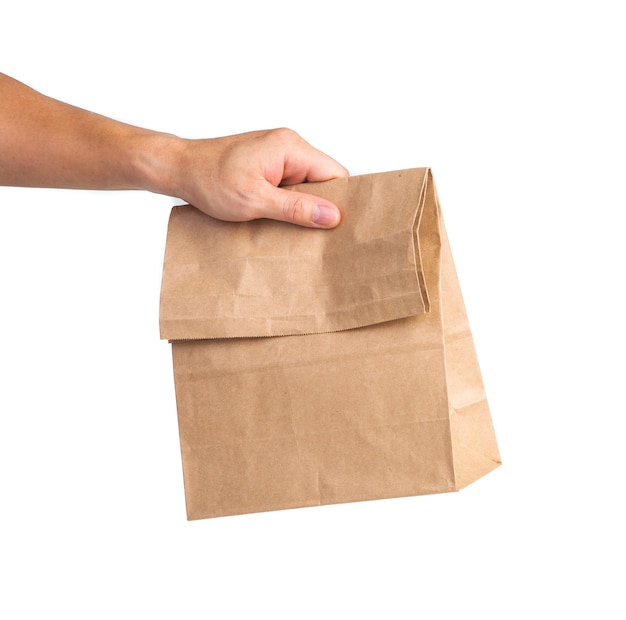 Man holding a brown paper bag