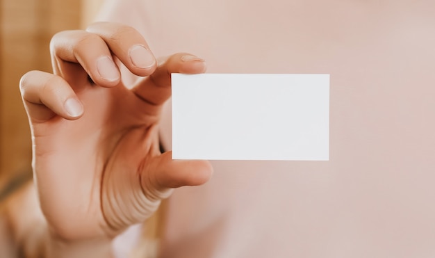 Man holding a business card with blank